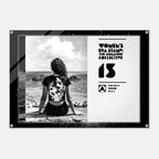 Poster with a woman sitting on a beach and text about 'Women's Era Stamp' on a white background