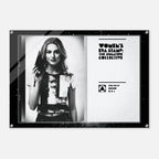 Black and white poster with a woman holding a gun, featuring 'Women's Era Stamp: The Signature Collective' branding.