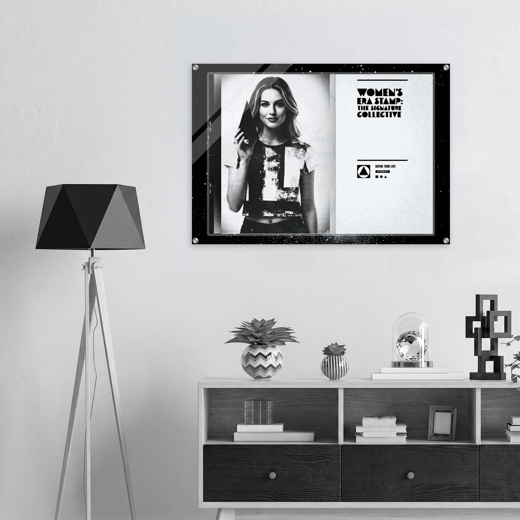 Framed poster of a woman on a wall above a shelf with decorative items.