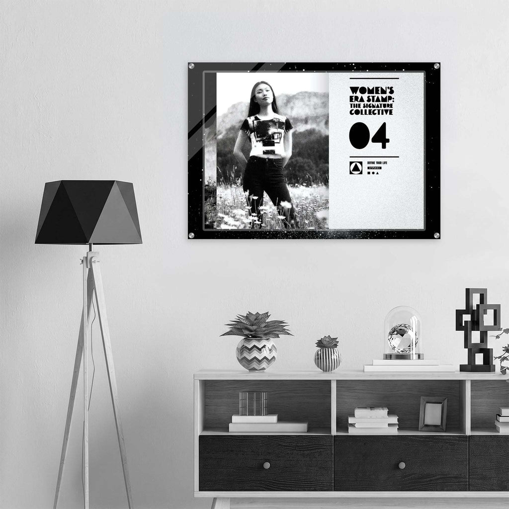 Framed artwork on a wall above a shelf with decorative items