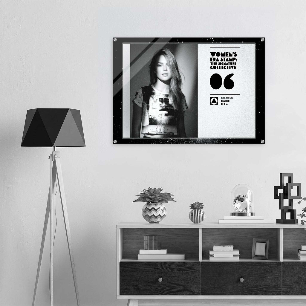 Framed artwork on a wall above a shelf with decorative items