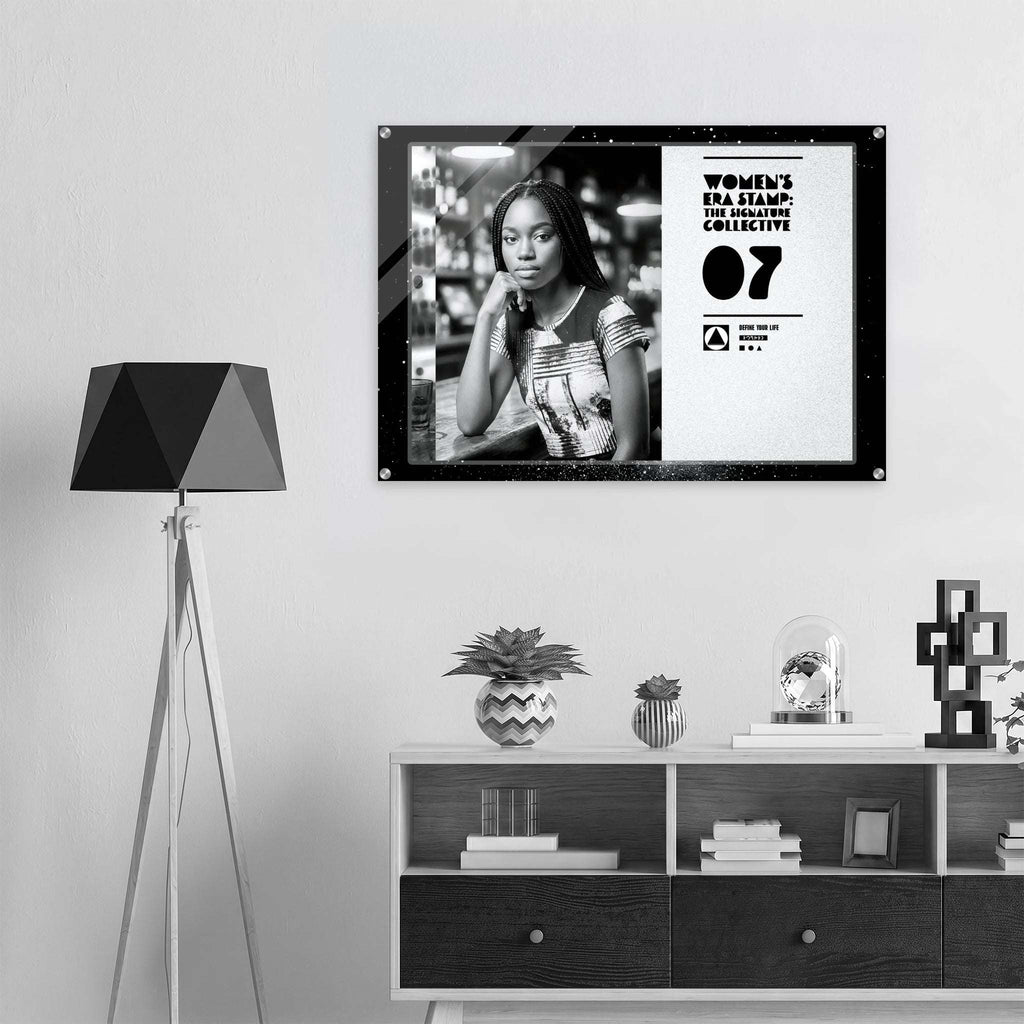 Framed poster of a woman with text on a wall above a shelf with decorative items.