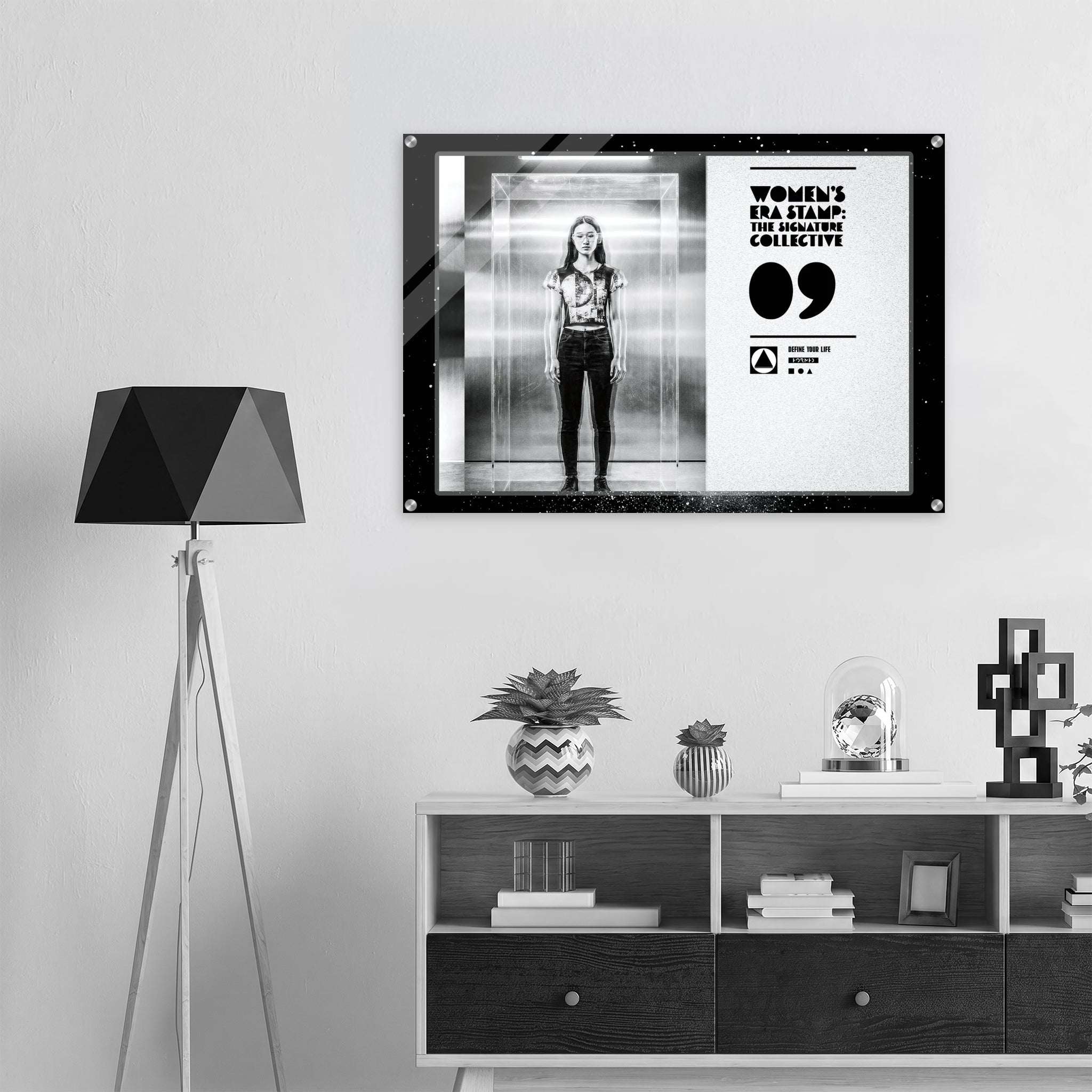 Framed artwork of a woman in an elevator on a wall above a shelf with decorative items.