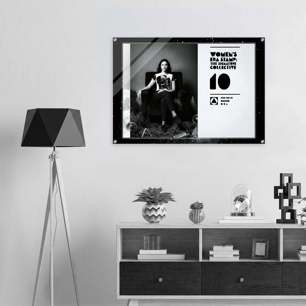 Framed poster on a wall above a shelf with decorative items