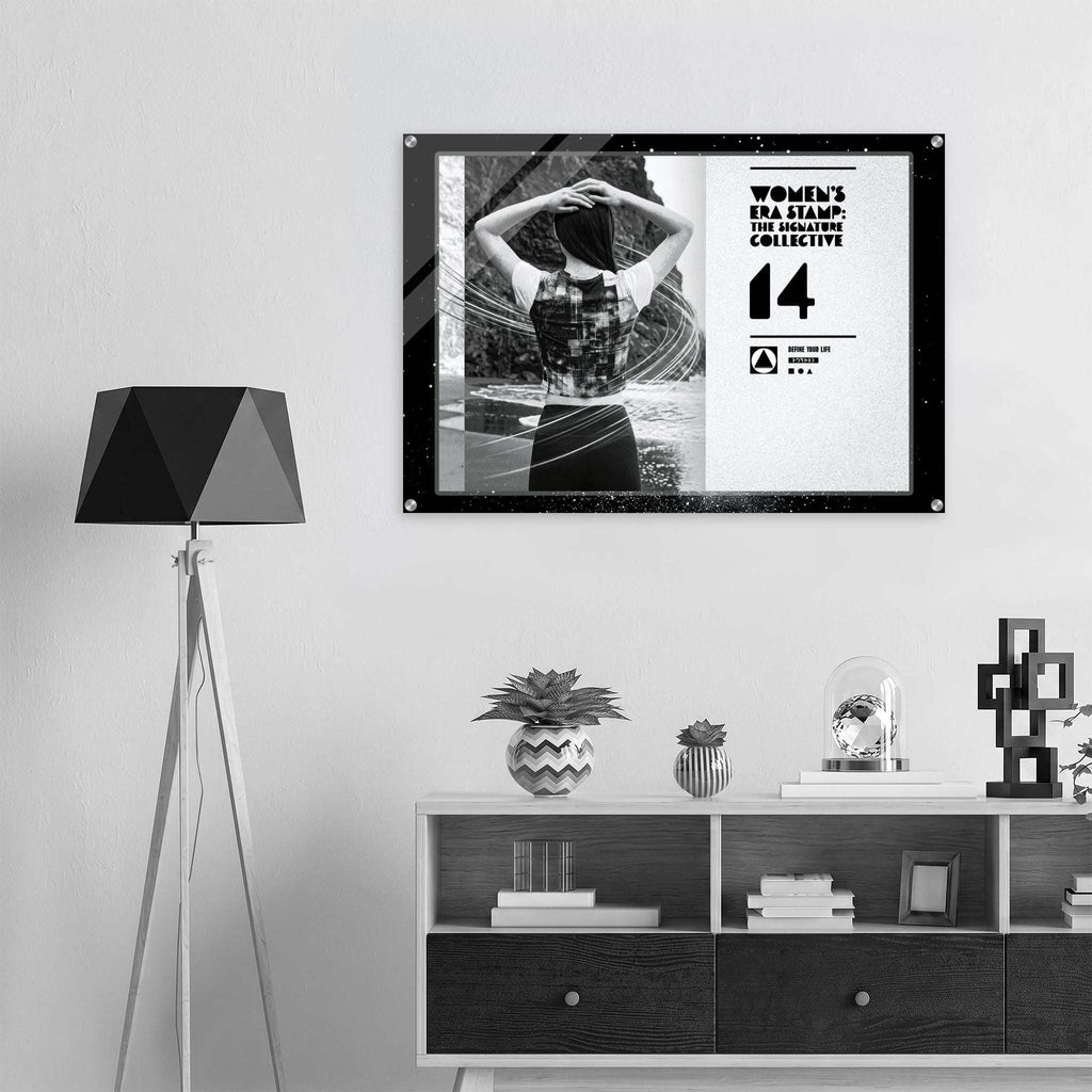Framed artwork on a wall above a shelf with decorative items