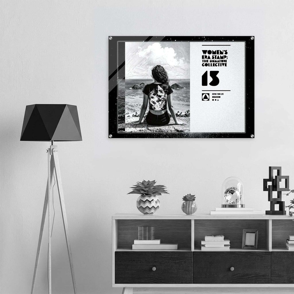 Framed artwork on a wall above a shelf with decorative items