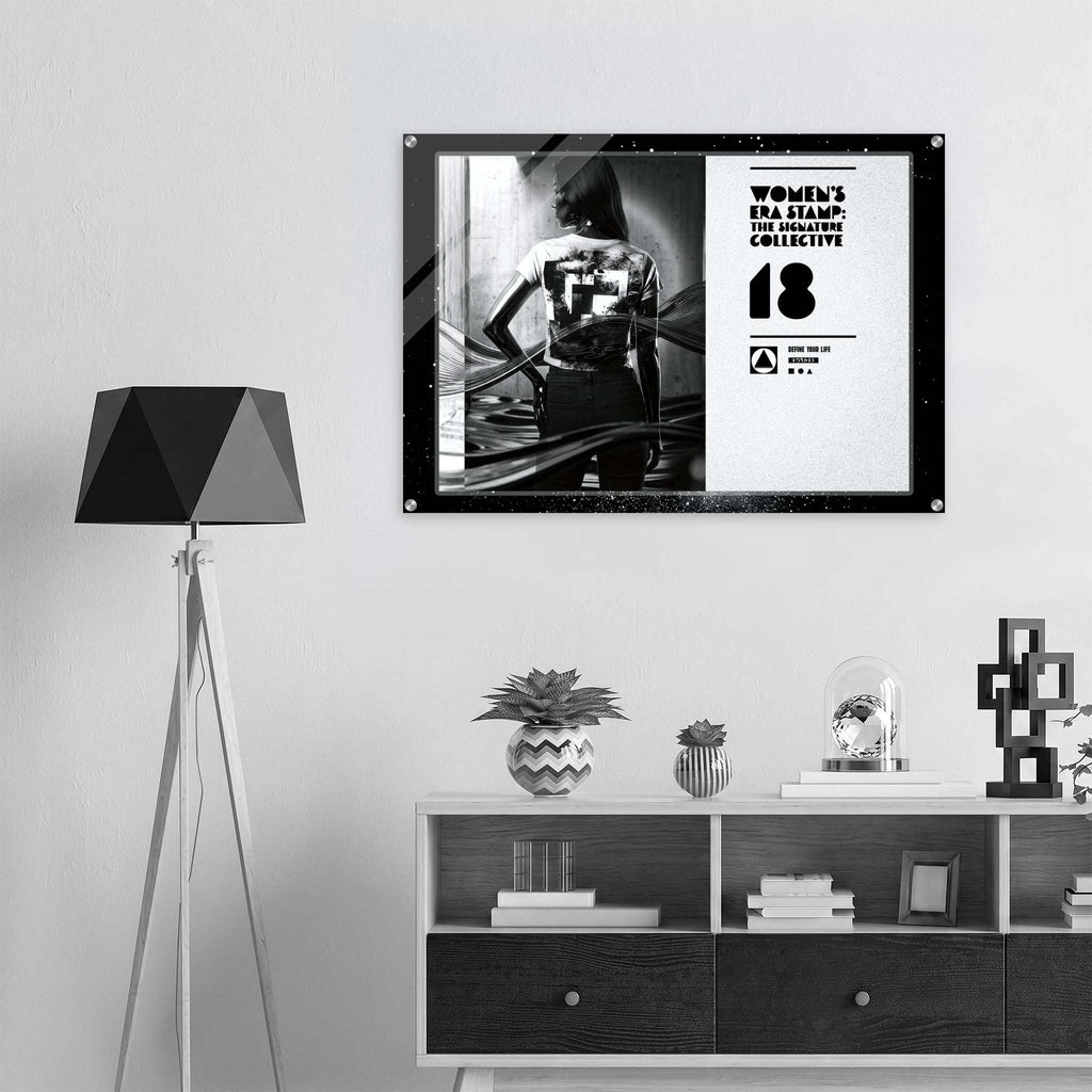 Framed artwork on a wall above a shelf with decorative items