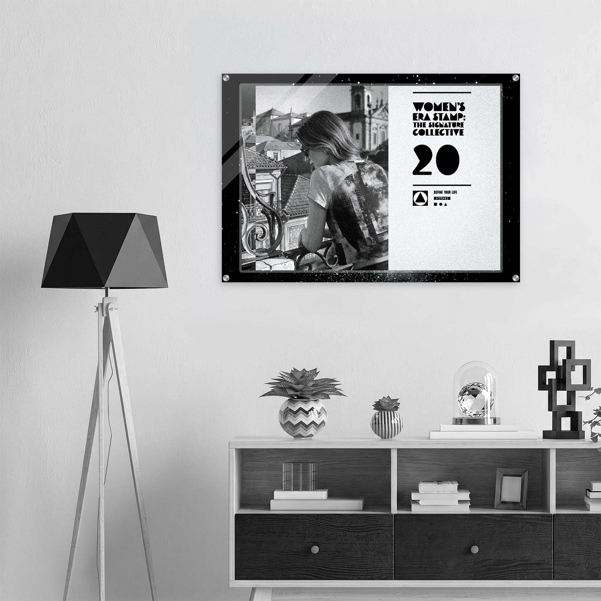 Framed poster on a wall above a shelf with decorative items