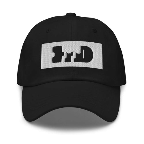Black baseball cap with light negative-space logo patch, front three-quarter view — Form Finding Design
