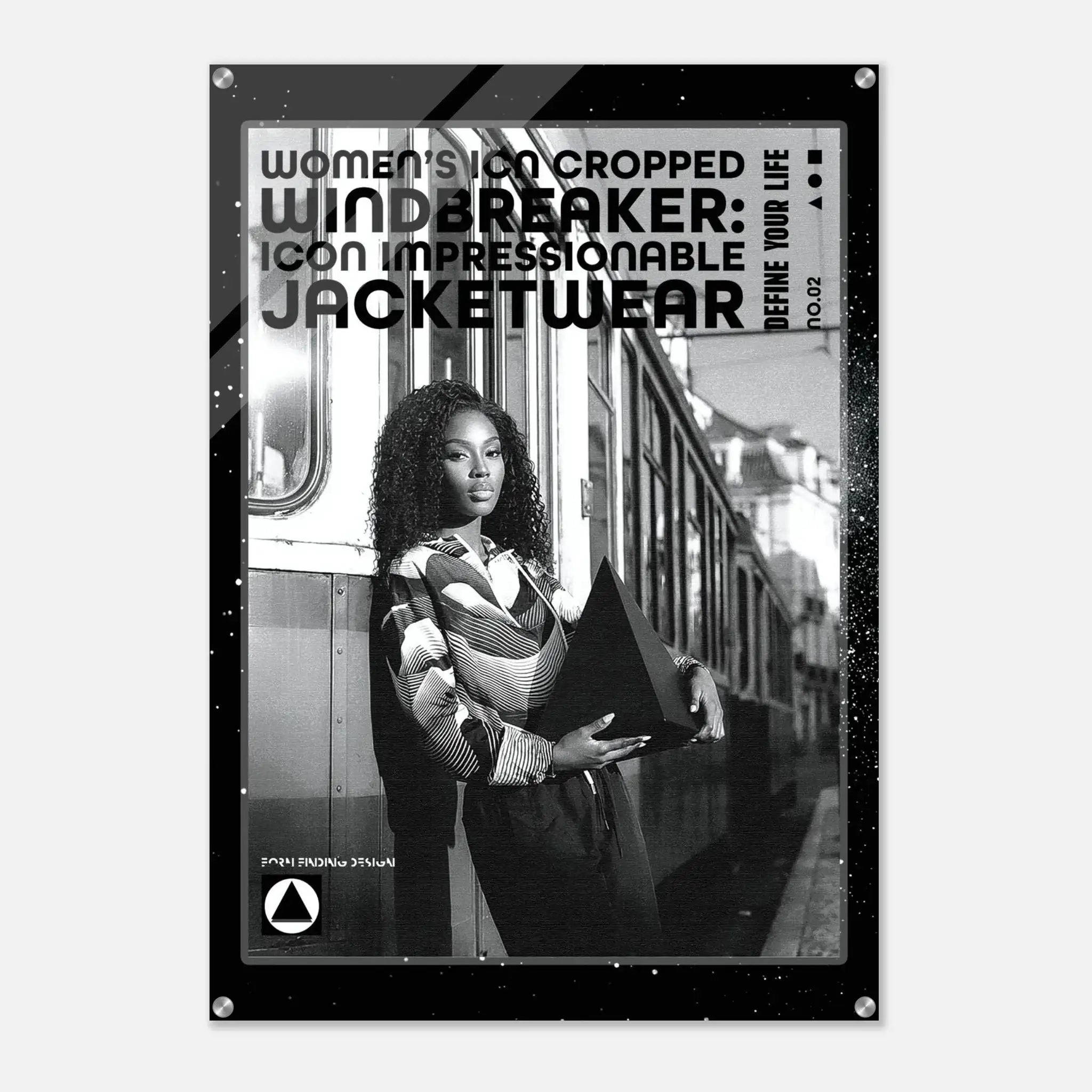 A black-framed poster or print featuring a black-and-white photograph of a woman standing beside a train, with large text reading 'WOMEN'S ICON CROPPED WINDBREAKER: ICON IMPRESSIONABLE JACKETWEAR' and smaller text 'DEFINE YOUR LIFE'.