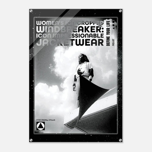 A black and white fashion poster featuring a model wearing a windbreaker jacket, with bold text reading 'WOMEN'S ICON CROPPED WINDBREAKER: ICON IMPRESSIONABLE JACKETWEAR' and 'DEFINE YOUR LIFE'.