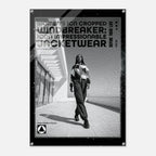 A black-framed poster or print featuring a black-and-white fashion photo of a woman walking outdoors, with large text reading 'WOMEN'S ICON CROPPED WINDBREAKER: ICON IMPRESSIONABLE JACKETWEAR' and smaller text 'DEFINE YOUR LIFE'.