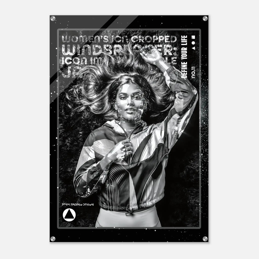 A black and white fashion poster print featuring a woman with flowing hair wearing a striped jacket, with distressed text including 'WOMEN'S ICON CROPPED WINDBREAKER' and 'DEFINE YOUR LIFE'.