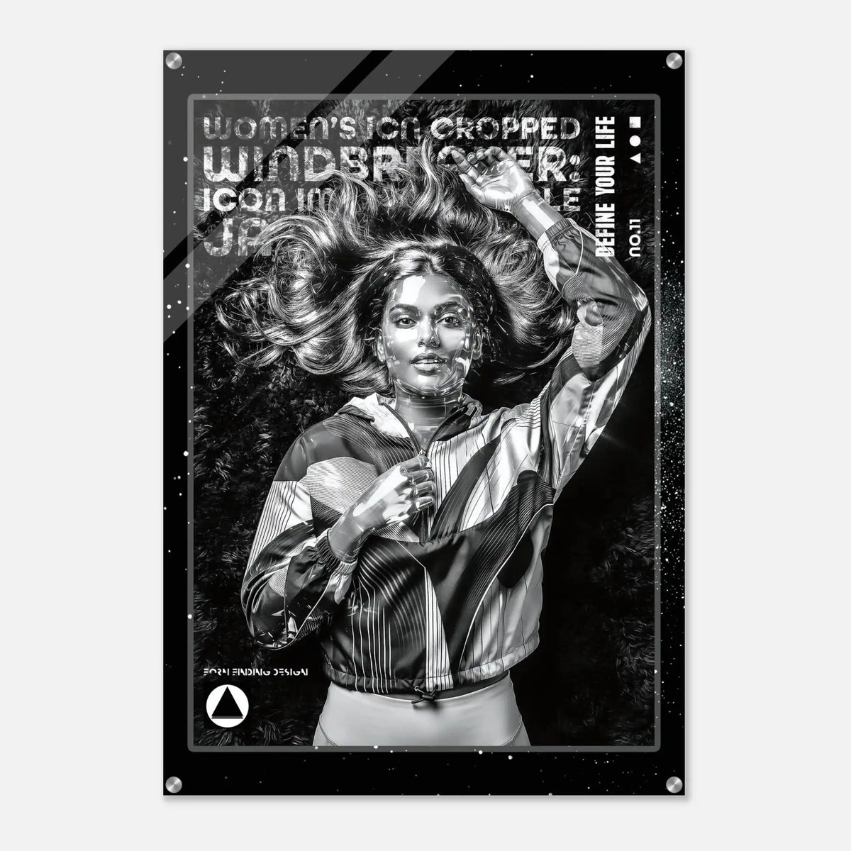 A black and white fashion poster print featuring a woman with flowing hair wearing a striped jacket, with distressed text including 'WOMEN'S ICON CROPPED WINDBREAKER' and 'DEFINE YOUR LIFE'.