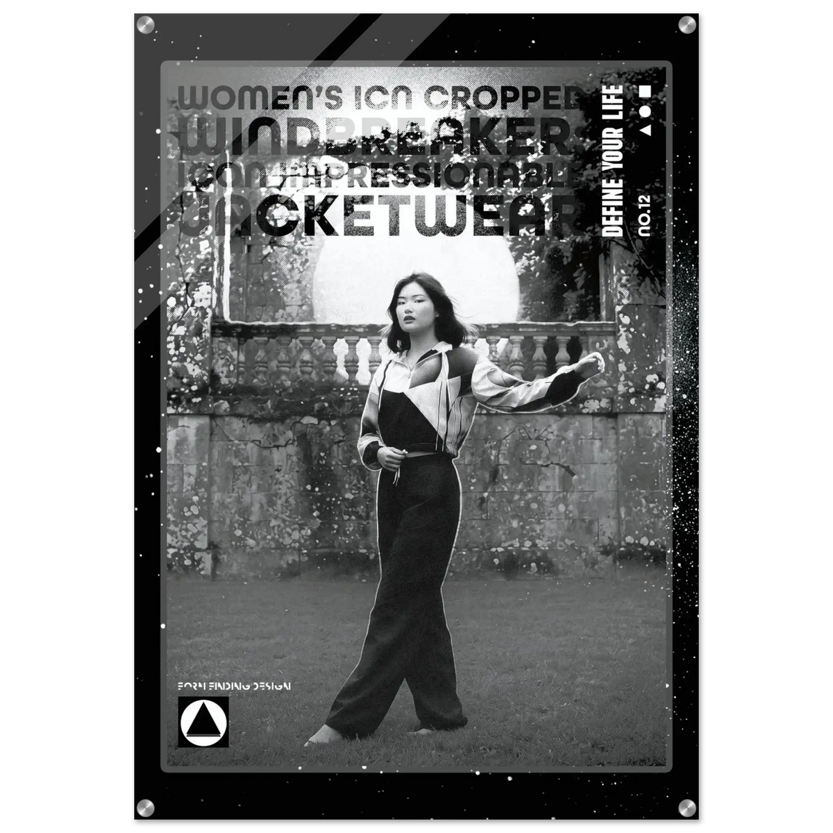 A black and white fashion poster or print featuring a woman standing outdoors in front of a stone wall, wearing a cropped jacket and wide-leg pants. Large distressed text across the top reads 'WOMEN'S CROPPED WINDbreaker JACKETWEAR' with smaller text including 'DEFINE YOUR LIFE'.