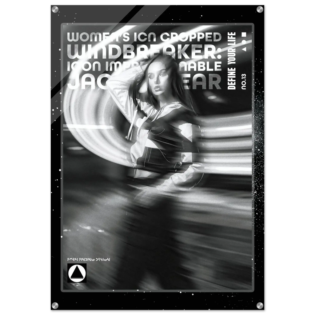 A black and white graphic poster or print featuring a stylized woman with motion-blur effects and bold text reading 'WOMEN'S ICON CROPPED WINDBREAKER' and 'DEFINE YOUR LIFE'. The design is monochrome with a dark border and small white speckles, shown against a light gray background.