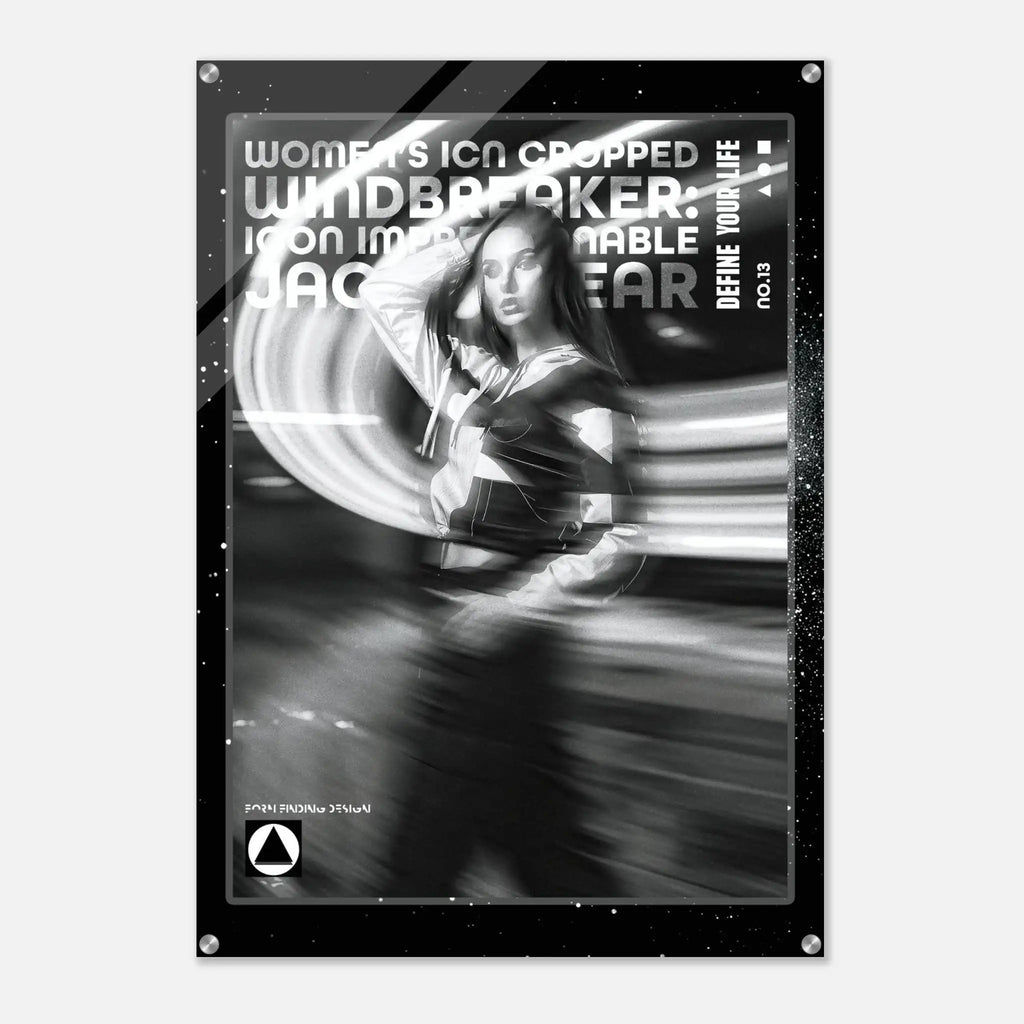 A black and white fashion poster featuring a woman in motion with dramatic light streaks, surrounded by a black border with text including 'WOMEN'S ICON CROPPED WINDBREAKER: ICON IMPRESSIONABLE JACKETWEAR' and 'DEFINE YOUR LIFE NO.13'.