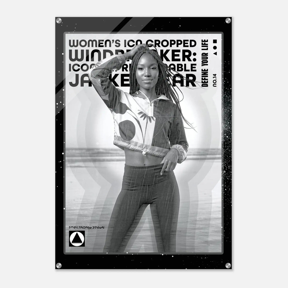A black-framed poster print featuring a grayscale photo of a woman posing in cropped windbreaker clothing, with bold text reading 'WOMEN'S ICON CROPPED WINDBREAKER: ICON IMPRESSIONABLE JACKETWEAR' and smaller text 'DEFINE YOUR LIFE NO.14'.