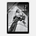 A black poster print featuring a black-and-white photo of a woman in a cropped windbreaker jacket sitting on a stone structure, with bold text reading 'WOMEN'S ICON CROPPED WINDBREAKER: ICON IMPRESSIONABLE JACKETWEAR' and 'DEFINE YOUR LIFE'.