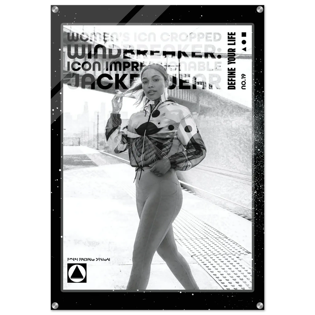 A black and white fashion poster featuring a model in a patterned jacket and fitted pants on a platform, with bold text including 'WINDBREAKER', 'JACKETWEAR', and 'DEFINE YOUR LIFE'.