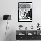 A black and white fashion poster for 'WINDBREAKER: ICON IMPRESSIONABLE JACKETWEAR' hanging on a light gray wall above a wooden shelf in a modern room setting with a tripod floor lamp.