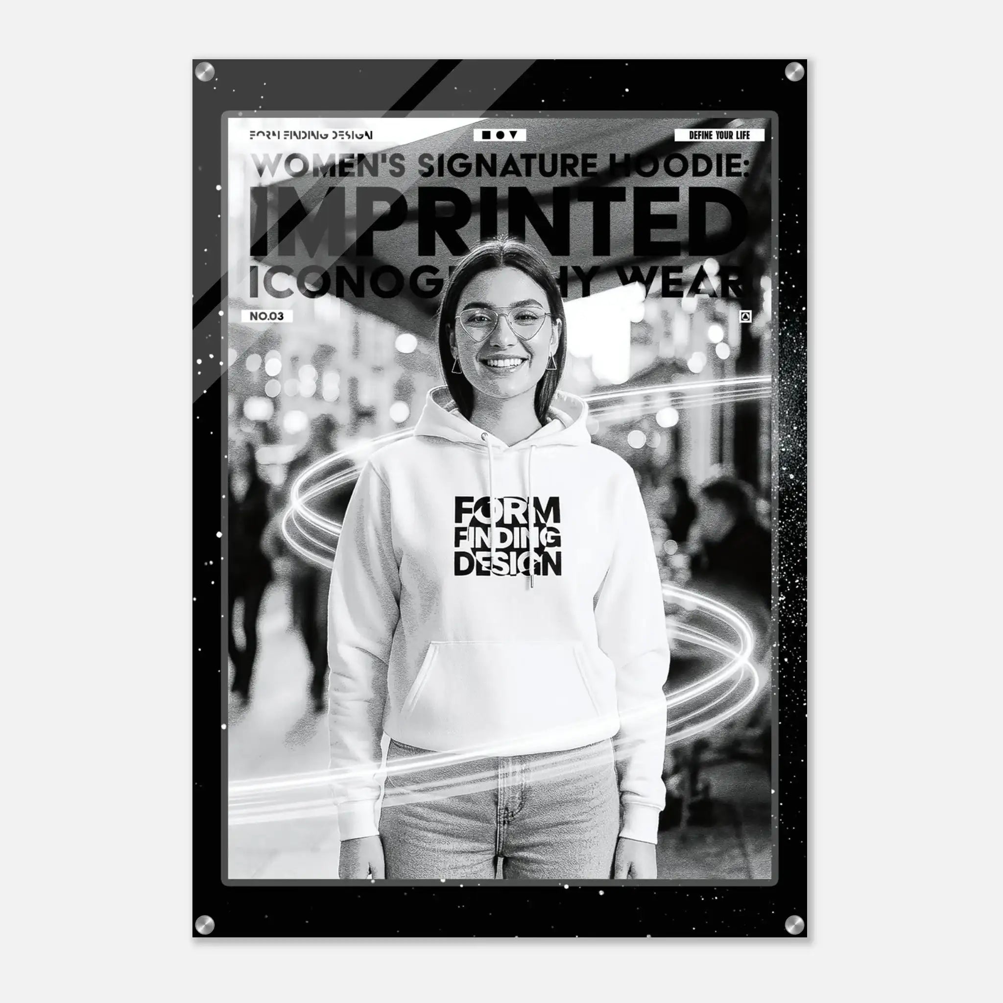 A black-framed poster or print featuring a black-and-white photo of a smiling woman wearing a white hoodie with bold text on the front. The poster includes decorative light streak graphics and text at the top reading 'WOMEN'S SIGNATURE HOODIE IMPRINTED ICONOGRAPHY WEAR'.