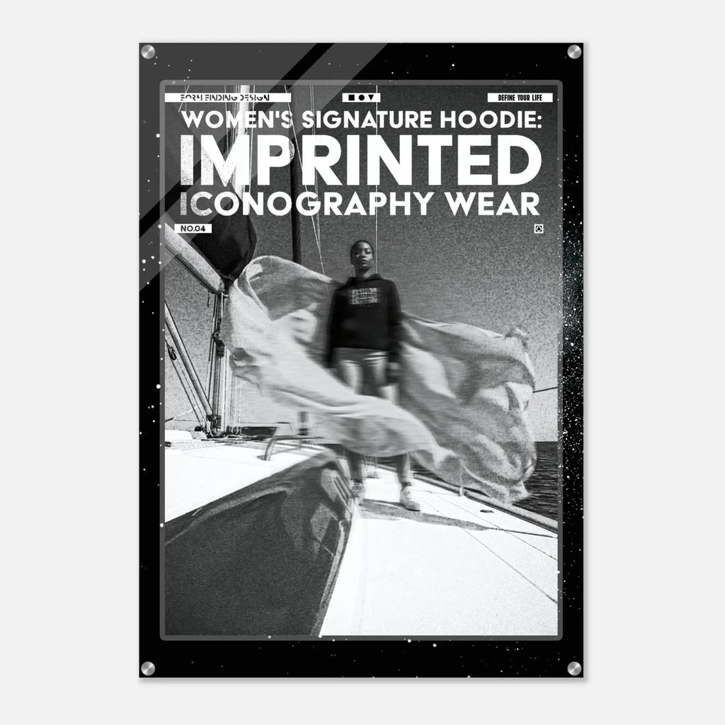 A black poster or print with a white border and text reading 'WOMEN'S SIGNATURE HOODIE: IMPRINTED ICONOGRAPHY WEAR' above a black-and-white photo of a person standing on a boat deck.