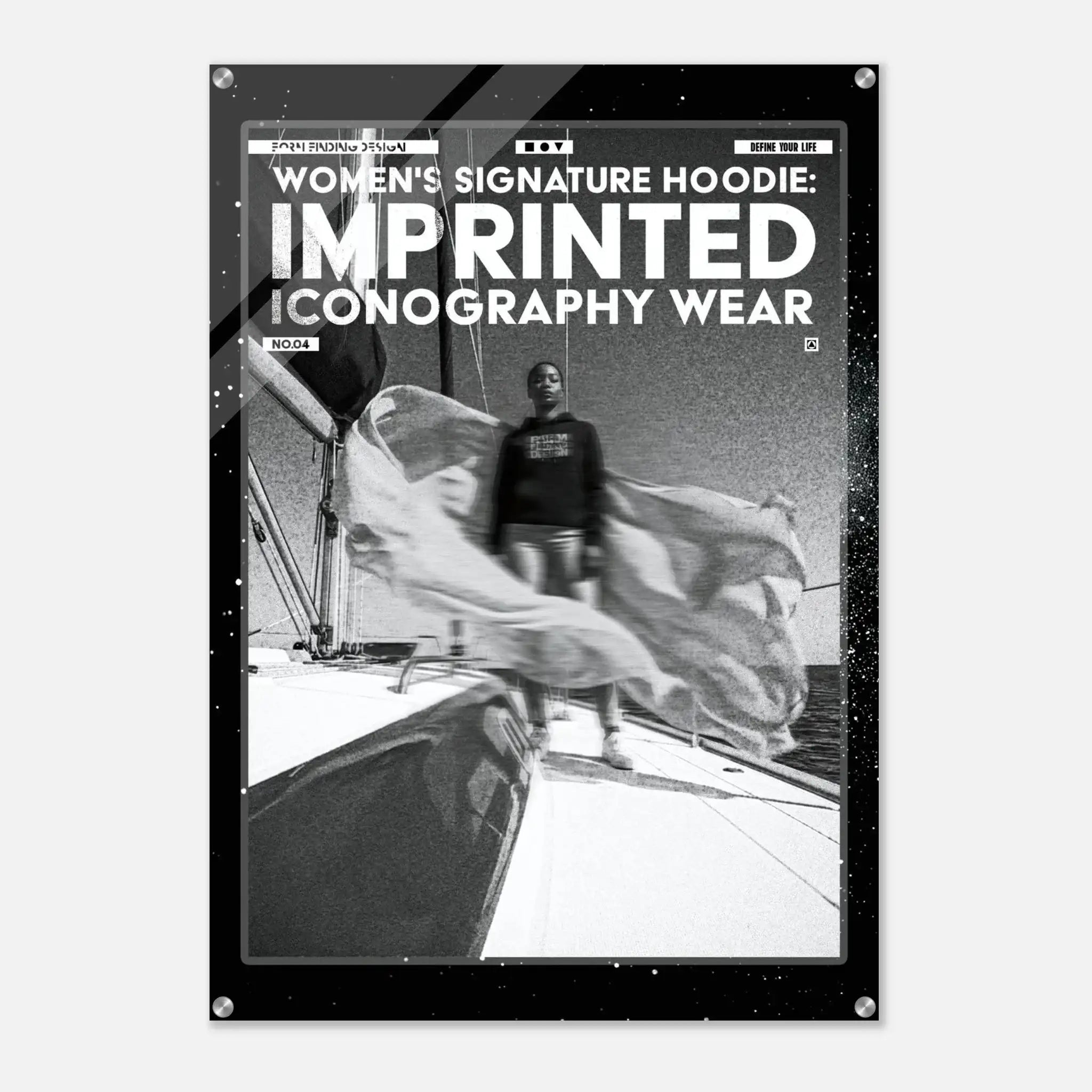 A black poster or print with a white border and text reading 'WOMEN'S SIGNATURE HOODIE: IMPRINTED ICONOGRAPHY WEAR' above a black-and-white photo of a person standing on a boat deck.