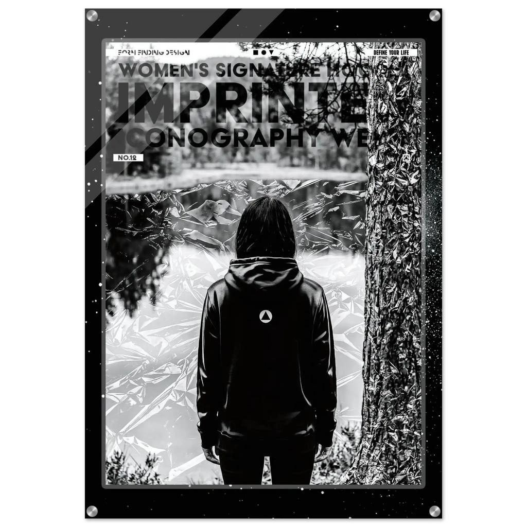 A black and white art print poster titled 'IMPRINTED ICONOGRAPHY WEAR' from 'WOMEN'S SIGNATURE HOODIE' featuring a person in a black hoodie seen from behind, standing in front of a tree and reflective water, with a black frame border.