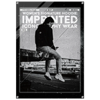 A black and white fashion poster featuring a seated person in a dark hoodie and jeans, with large distressed text reading 'WOMEN'S SIGNATURE HOODIE: IMPRINTED ICONOGRAPHY WEAR' and 'NO.16'.