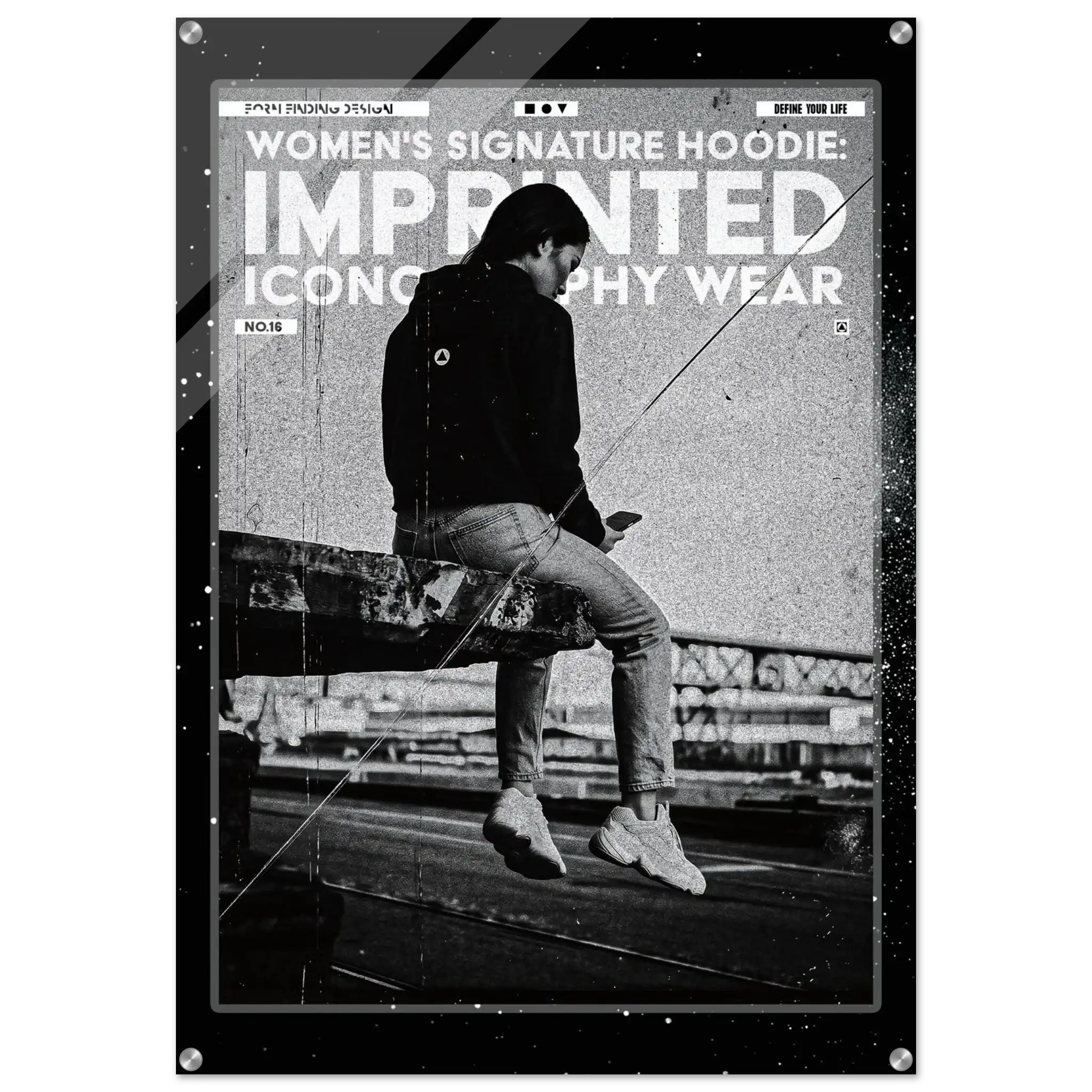 A black and white fashion poster featuring a seated person in a dark hoodie and jeans, with large distressed text reading 'WOMEN'S SIGNATURE HOODIE: IMPRINTED ICONOGRAPHY WEAR' and 'NO.16'.