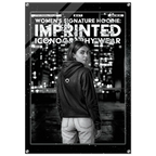 A black and white fashion poster featuring a woman from behind wearing a ribbed hoodie with a small circular logo on the back, set against a city skyline at night. The poster has a distressed, typographic design with the text 'WOMEN'S SIGNATURE HOODIE: IMPRINTED ICONOGRAPHY WEAR' and 'FORM FINDING DESIGN'.