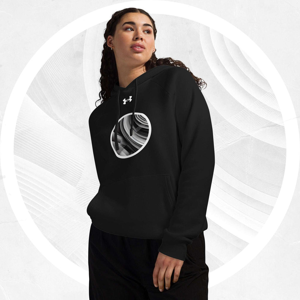 Three-quarter front model shot wearing the black Form Finding Design Under Armour® x Ring Stamp Hoodie (No.11); circular ring-stamp emblem centred on the chest, drawstrings visible, set against a light grey abstract backdrop with a white halo ring.