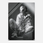 A black and white art print or poster featuring a seated woman in a torn-paper collage style, displayed against a light gray background with visible mounting holes in the corners.