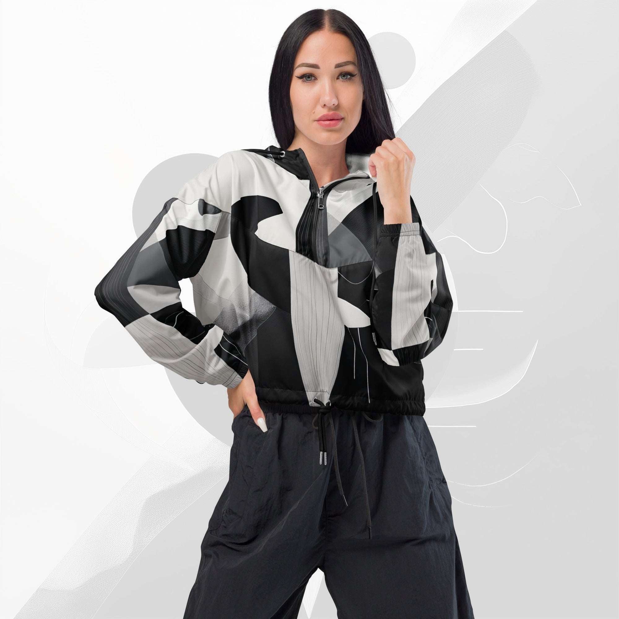 Front pose of model in FormFD Women’s ICN Cropped Windbreaker No.13—half-zip hooded cropped windbreaker with high-contrast black stripe motif across chest and sleeves.
