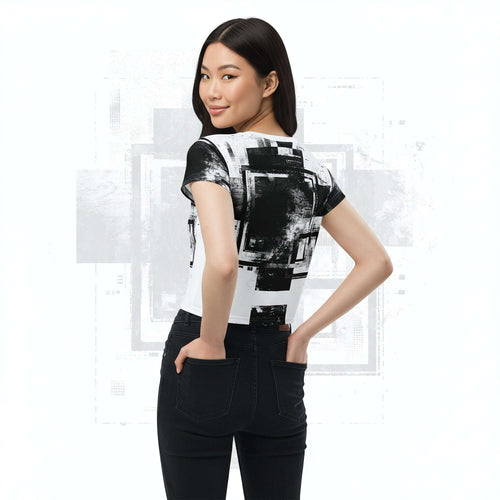 Rear view of model in Form Finding Design Women’s Era Stamp (No.04) crop tee; black-and-white distressed geometric print wraps the back and sleeves, styled with black jeans on a pale white background.