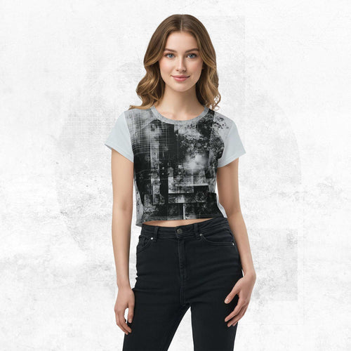 Model wearing Form Finding Design Women’s Era Stamp (No.20) crop tee; bold monochrome distressed geometry print on the front, styled with black jeans against a soft white textured backdrop.