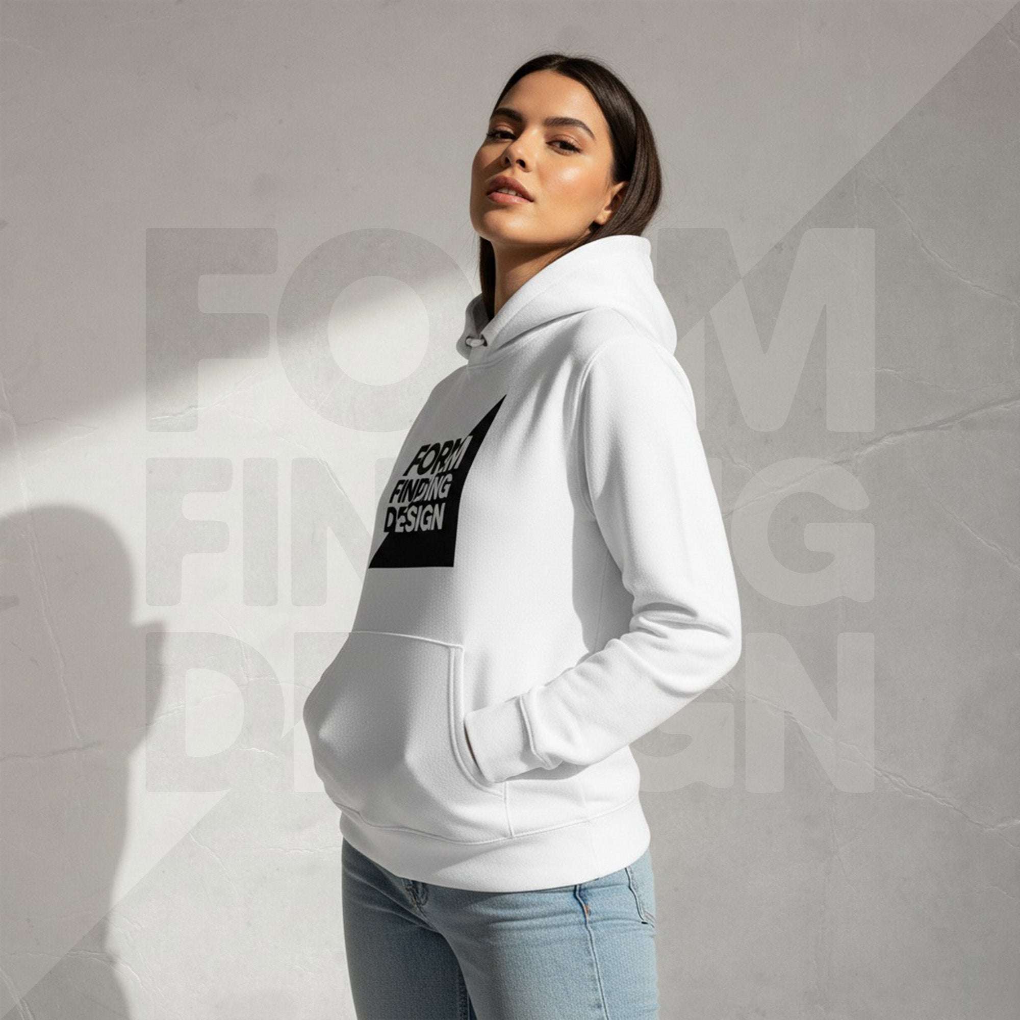 Side profile of model wearing white Women’s Signature Hoodie (FFD-11) by Form Finding Design—hood up behind neck, front pouch pocket silhouette, partial chest logo visible.