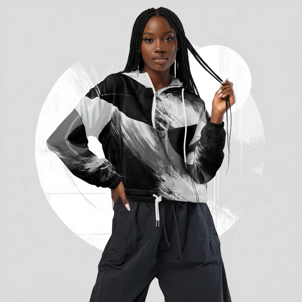 Second lifestyle pose in ICN Cropped Windbreaker No.10—monochrome black-and-white stripe print emphasised across chest and sleeves, cropped silhouette with drawcord hem from Form Finding Design.