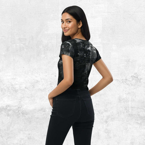 Three-quarter side/back view of model in Form Finding Design Women’s Era Print (No.03) crop tee — distressed monochrome newsprint collage print, cropped hem, fitted sleeves, paired with black jeans.