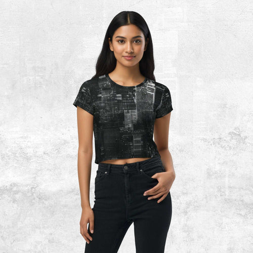Model wearing Form Finding Design Women’s Era Print (No.03) cropped tee — black-and-white newsprint collage pattern across torso and sleeves, crew neck, styled with black jeans.
