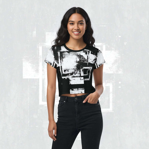 Model wearing Form Finding Design Women’s Era Stamp (No.03) crop tee; bold monochrome distressed geometry print on the front, styled with black jeans against a soft black textured backdrop.