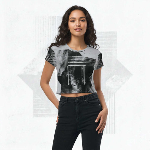 Model wearing Form Finding Design Women’s Era Stamp (No.08) crop tee; bold monochrome distressed geometry print on the front, styled with black jeans against a soft white textured backdrop.