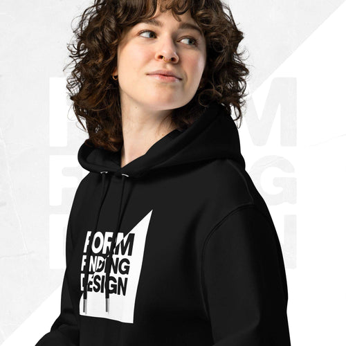 Close-up of black Form Finding Design Signature Hoodie (FFD-12)—hood, drawstrings and chest print detail showing the white square “FORM FINDING DESIGN” iconography graphic.