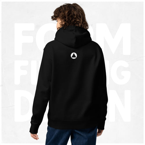 Back view on model: black Women’s Signature Hoodie (FFD-18) by Form Finding Design—minimal back with small white triangle emblem below hood, clean studio background.