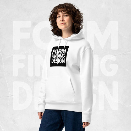 Model wearing white Form Finding Design Women’s Signature Hoodie (FFD-19), three-quarter front—bold black square logo print centred on chest, relaxed fit, soft grey studio backdrop.