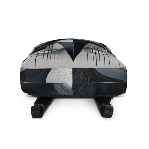 Bottom view of Form Finding Design AD7 backpack showing the base and wraparound monochrome geometric print, textured fabric finish, and the lower strap anchors for a clean, minimal designer backpack look.