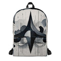 Form Finding Design AD7 backpack – front view of medium all-over print backpack with monochrome abstract geometric artwork in black, charcoal and pale grey, large front pocket panel, top carry loop and black straps.
