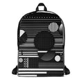 Form Finding Design AG6 backpack, front view on white background — medium all-over print backpack with bold black-and-white abstract geometric collage artwork, top carry handle and zip front pocket.