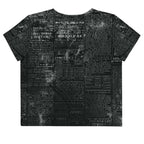 Flat studio mockup of Form Finding Design “Women’s Era Print” crop tee, back — monochrome handwritten script collage across body and sleeves; crew neck, cropped hem; The Signature Collective.